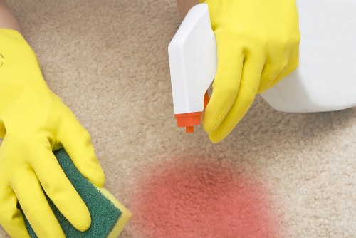 Professional carpet cleaner working in an SE17 home